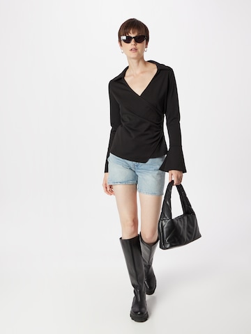 Warehouse - Blusa en negro