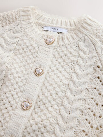 Next Neuletakki värissä beige