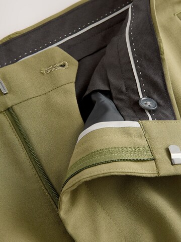 Skinny Pantalon à plis Next en vert