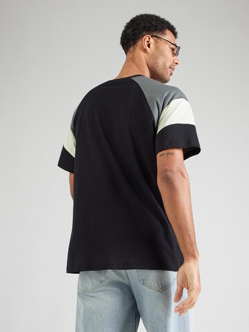 Iriedaily Póló 'Flowing' - fekete