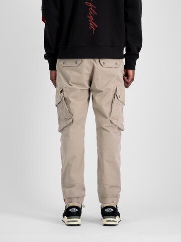 ALPHA INDUSTRIES Tapered Cargo nadrágok 'Combat' - bézs
