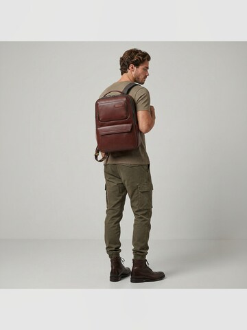The Bridge Backpack in Brown: front