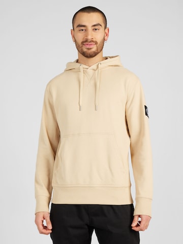 Sweat-shirt Calvin Klein Jeans en beige : devant